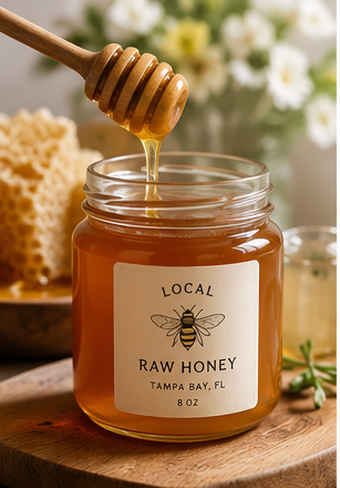 Styled jar of local honey with honey dipper from The Honey Couple